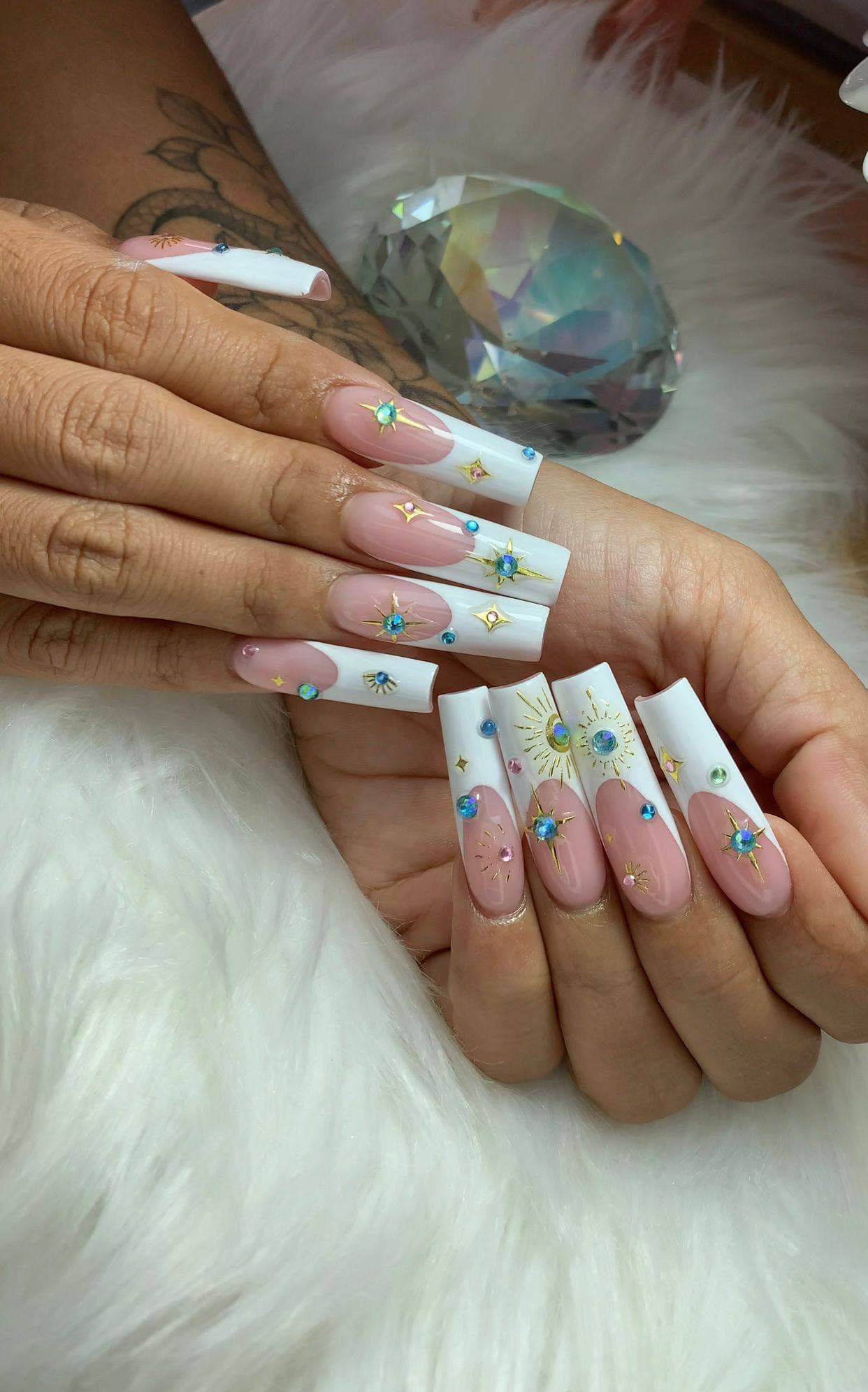 Long nails with gemstone art